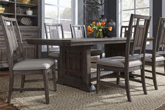 Zander Transitional 7 Piece Trestle Table Dining Set With Aged Oak Finish And Lattice Back Side Chairs