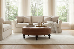 Carver 42 Inch Round Center Button Ottoman With Turned Legs