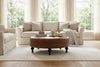 Carver 42 Inch Round Center Button Ottoman With Turned Legs