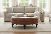 Carver 42 Inch Round Center Button Ottoman With Turned Legs